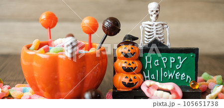 Happy Halloween day with ghost candies, pumpkin bowl, Jack O lantern and decorative (selective focus). Trick or Threat, Hello October, fall autumn, Festive, party and holiday concept Happy Halloween day with ghost candies, pumpkin bowl, Jack O lantern and decorative (selective focus). Trick or Threat, Hello October, fall autumn, Festive, party and holiday concept 105651738