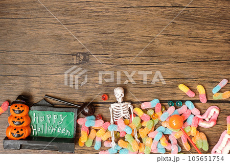 Happy Halloween day with ghost candies, pumpkin,  bowl and decorative. Trick or Threat, Hello October, fall autumn, Festive, party and holiday concept 105651754