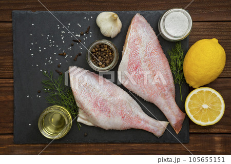 Seafood. Sea perch on a black board. 105655151