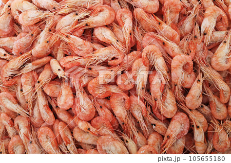 Shrimps. The fish market. Shrimps background texture. A lot of sea shrimp 105655180