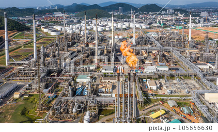 Aerial top view Oil and Gas refinery petrochemical plant industrial with oil and gas storage tank. White oil and gas refinery storage tank. Aerial view oil and gas refinery plant from industrial zone. Aerial top view Oil and Gas refinery petrochemical plant industrial with oil and gas storage tank. White oil and gas refinery storage tank. Aerial view oil and gas refinery plant from industrial zone. 105656630