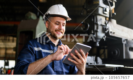 Mechanical engineer technician checking and inspecting machine at repair shop Mechanical engineer technician checking and inspecting machine at repair shop 105657657