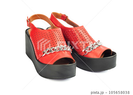 Stylish womens sandals isolated on white. Female red leather sandals on white background 105658038