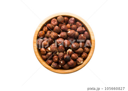 Roasted hazelnut in bowl isolated on white background. hazelnut is snack or raw of cook. Healthy food concept Roasted hazelnut in bowl isolated on white background. hazelnut is snack or raw of cook. Healthy food concept 105660827