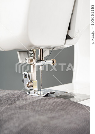 Modern sewing machine with gray fabric Modern sewing machine with gray fabric 105661165