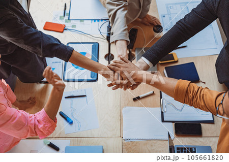 Group of coworkers stacking hands together one by one in unity. Support and motivation concept Group of coworkers stacking hands together one by one in unity. Support and motivation concept 105661820