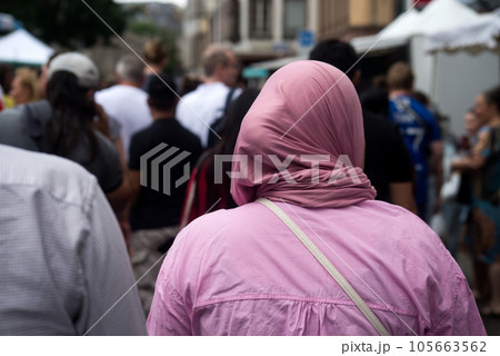 Portrait on back view of Veiled Muslim woman walking in the street Portrait on back view of Veiled Muslim woman walking in the street 105663562