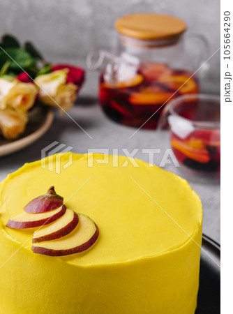 yellow cake with tea and roses 105664290
