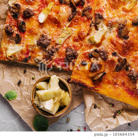 pizza with minced meat, artichokes and mushrooms 105664354