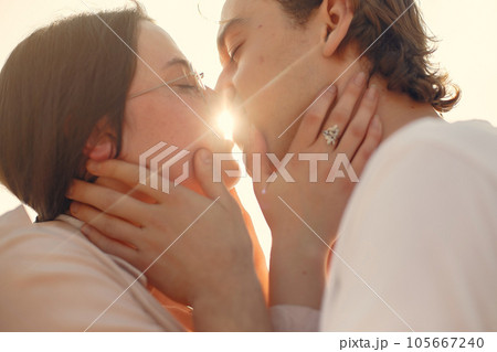 Couple in a summer park. Man in a white t-shirt. 105667240