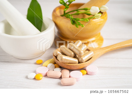 Alternative medicine herbal organic capsule with vitamin E omega 3 fish oil, mineral, drug with herbs leaf natural supplements for healthy good life. 105667502