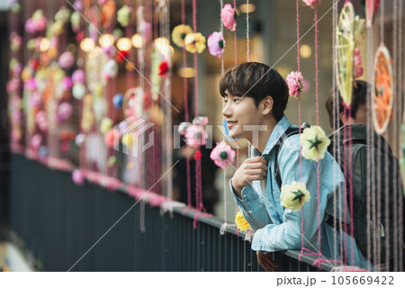 a man traveling around the city in a backpack 105669422
