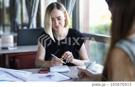 Beautiful smiling cheerful girl at workplace Beautiful smiling cheerful girl at workplace 105670915
