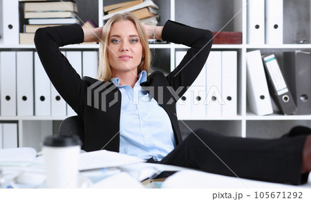 Business woman resting in the office after a working Business woman resting in the office after a working 105671292