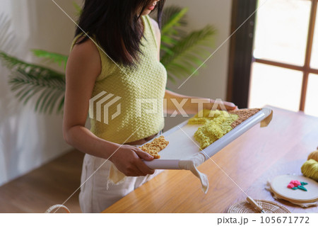 Hand embroidery concept, Women hold embroidery frame diy product making from punch needle technique Hand embroidery concept, Women hold embroidery frame diy product making from punch needle technique 105671772