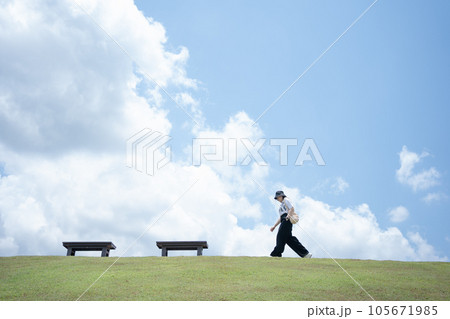solo woman happy and enjoy with summer travel with cloudy background solo woman happy and enjoy with summer travel with cloudy background 105671985