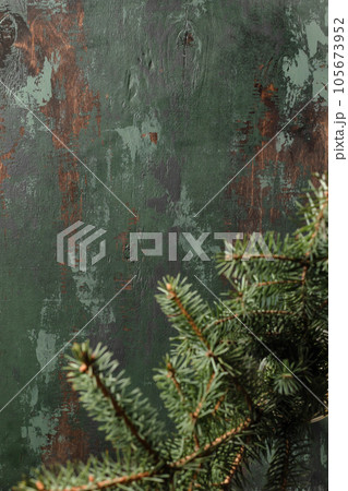 Top view of green wooden background with Christmas fir tree, cozy xmas flat lay Top view of green wooden background with Christmas fir tree, cozy xmas flat lay 105673952