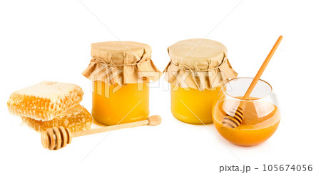 Sweet honeycomb, Honey pots and wooden dipper isolated on white . Collage. Wide photo. 105674056
