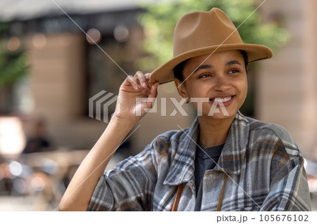 Pretty smiling girl in a straw hat Pretty smiling girl in a straw hat 105676102