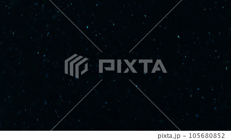 Glowing particles. Sparkles texture. Shimmer rain. Blur blue color light dust flakes floating on dark black free space abstract background. Glowing particles. Sparkles texture. Shimmer rain. Blur blue color light dust flakes floating on dark black free space abstract background. 105680852