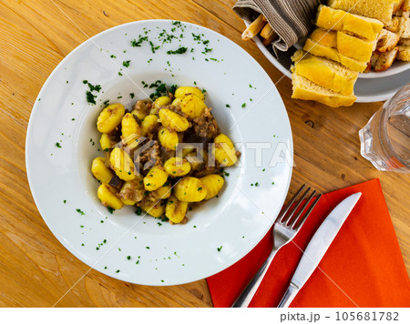 Gnocchi with mince and eggplant 105681782