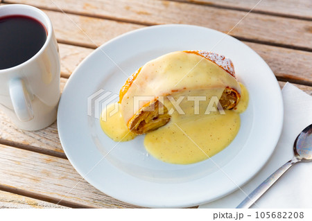 Strudel with cup of mulled wine 105682208