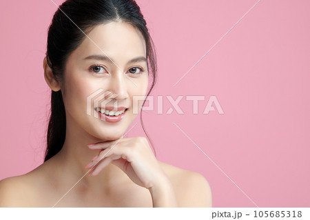 Beautiful young asian woman with clean fresh skin on pink background, Face care, Facial treatment, Cosmetology, beauty and spa, Asian women portrait. Beautiful young asian woman with clean fresh skin on pink background, Face care, Facial treatment, Cosmetology, beauty and spa, Asian women portrait. 105685318