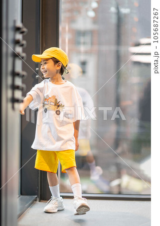 little boy in yellow hat and smiling little boy in yellow hat and smiling 105687267