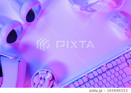 Gaming accessories on purple desk 105690353