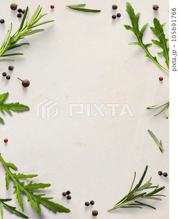 Art frame / border italian cooking background; old parchment with fresh mediterranean herbs leaves; allspice rosemary arugula Art frame / border italian cooking background; old parchment with fresh mediterranean herbs leaves; allspice rosemary arugula 105691766