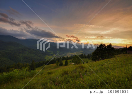Beautiful summer sunset scene in the mountains with spectacular sky. 105692652