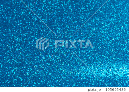 An abstract blue background with sparkle lights and bokeh. An abstract blue background with sparkle lights and bokeh. 105695486