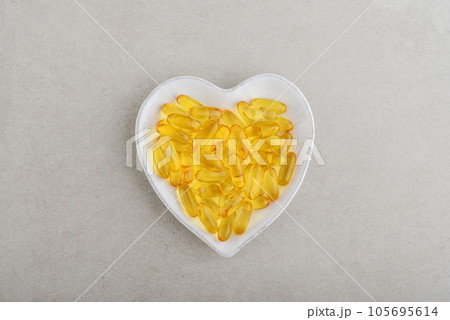 Top view of omega-3 fish oil capsules Top view of omega-3 fish oil capsules 105695614