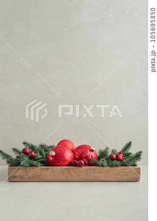 Christmas decorations from fir tree branches and red christmas balls 105695850