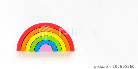 Wooden rainbow isolated on a white background. The rainbow toy puzzle. LGBT flag gay pride community, equal rights movement and gender equality life concept. Flat lay, top view, copy space Wooden rainbow isolated on a white background. The rainbow toy puzzle. LGBT flag gay pride community, equal rights movement and gender equality life concept. Flat lay, top view, copy space 105695960