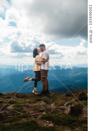 A couple kiss on the mountain 105696001