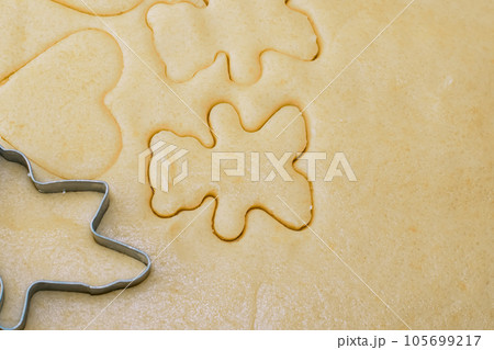 Girl bakes Christmas cookies, cooking in the kitchen. 105699217