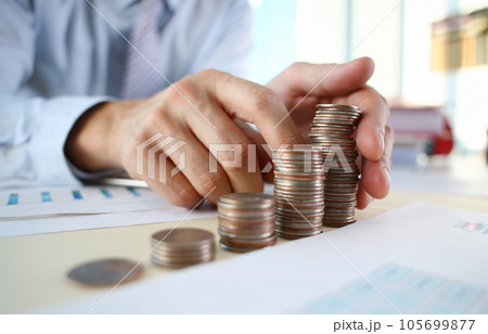 Hand businessman putting pin money Hand businessman putting pin money 105699877