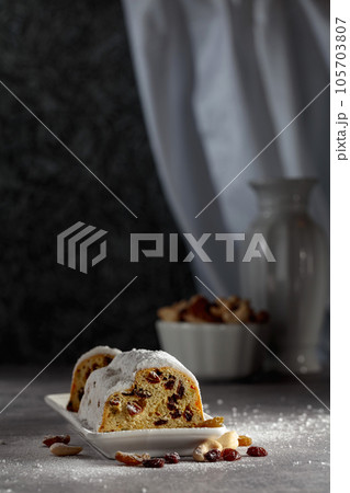 Traditional fruit cake for Christmas with raisins and nuts. 105703807