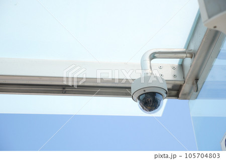 CCTV security camera operating outdoor  105704803