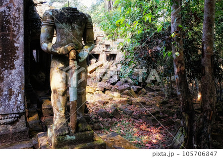 An ancient damaged statue near the Khmer ruins in Cambodia. An ancient damaged statue near the Khmer ruins in Cambodia. 105706847