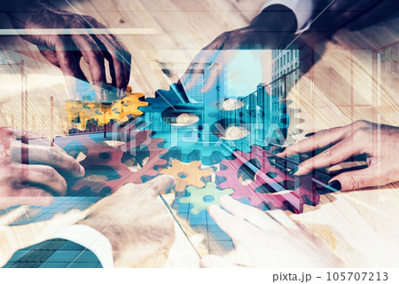Business team connect pieces of gears. Teamwork, partnership and integration concept 105707213