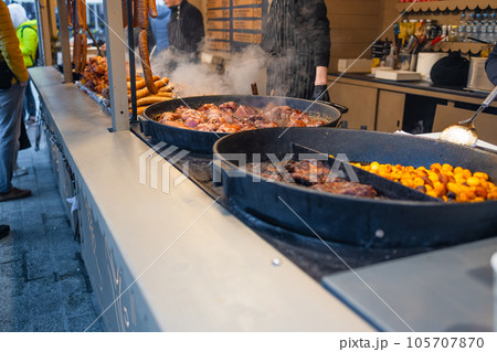Traditional meats stand in Krakow at street food vendor market, grilled satay. food festival. Traditional meats stand in Krakow at street food vendor market, grilled satay. food festival. 105707870