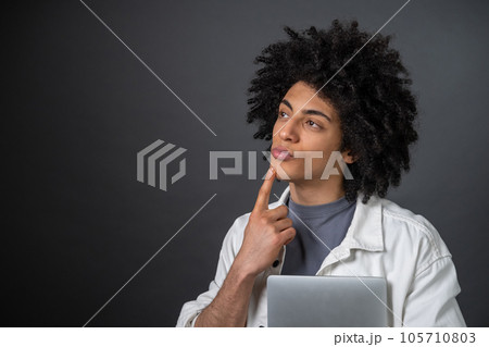 Young freelancer looking thoughtful and focused 105710803