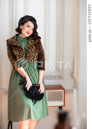 beautiful and happy brunette in retro clothes, beret and with a handbag. beautiful and happy brunette in retro clothes, beret and with a handbag. 105710897