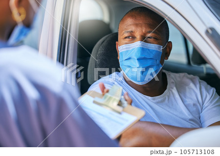 Test, interview and talking being done at a checkpoint during covid lockdown for traveling, transport and trips. Man wearing a mask to protect, keep safe and prevent sickness while filling in forms 105713108