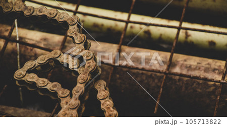 Scrap metal for recycling background. a lot of different rusty industrial part detail for melt and reused. Old rusty metal surface. Abstract background for design purpose. Warm orange color. Random Scrap metal for recycling background. a lot of different rusty industrial part detail for melt and reused. Old rusty metal surface. Abstract background for design purpose. Warm orange color. Random 105713822