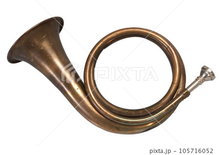 Vintage brass hunting horn isolated on a white Vintage brass hunting horn isolated on a white 105716052