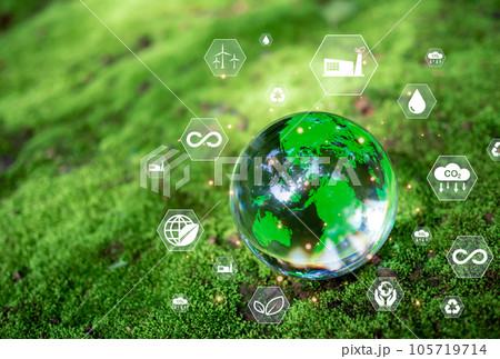 Crystal ball on moss in green forest. CO2 emission reduction concept, clean and friendly environment without carbon dioxide emissions. Planting trees to reduce CO2 emissions, environmental protection 105719714