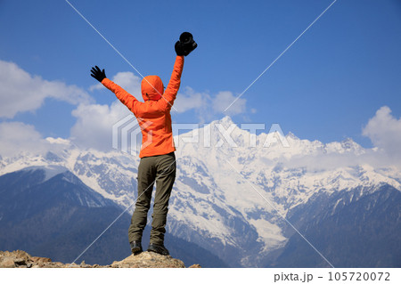 Woman hiker hiking in winter hugh altitude mountain,China 105720072